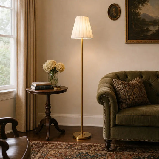 Living room with a lamp, side table, and sofa.